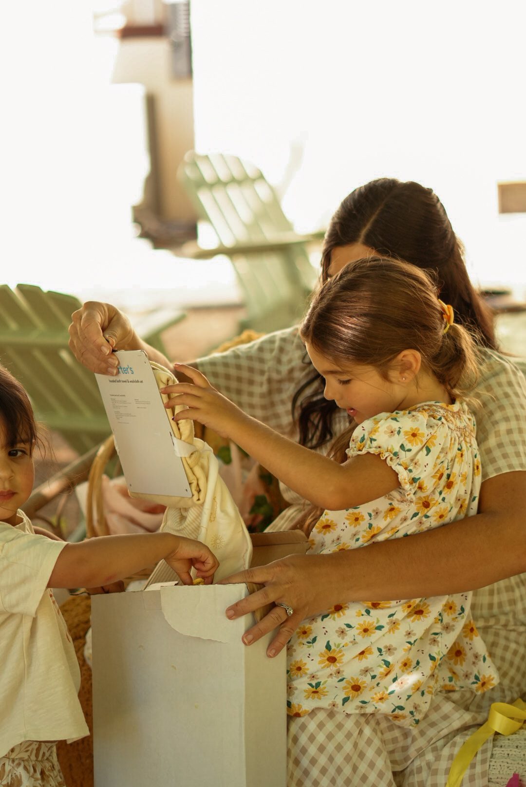 Guests reading a card together at a baby shower