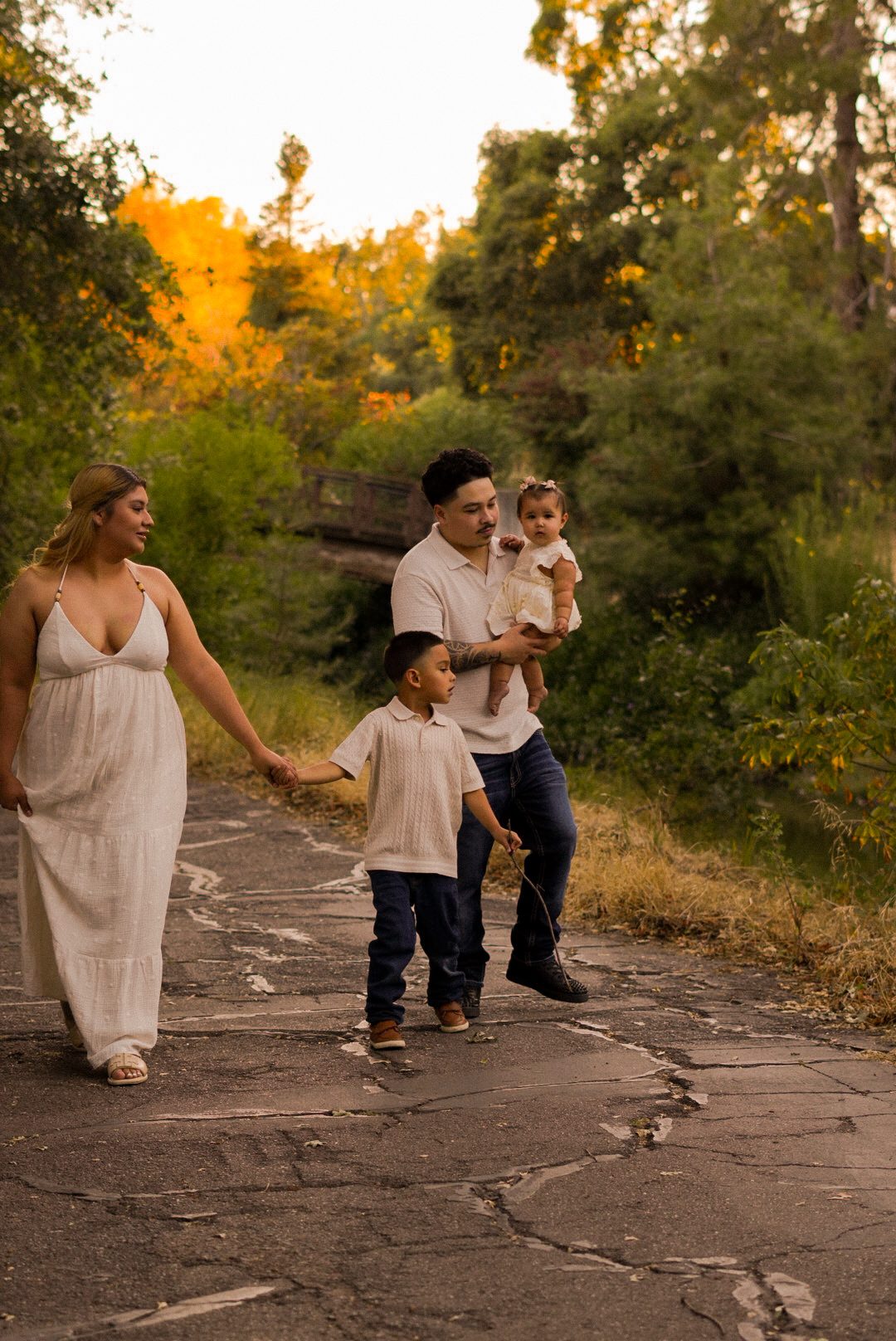 Family walking together down a garden path
