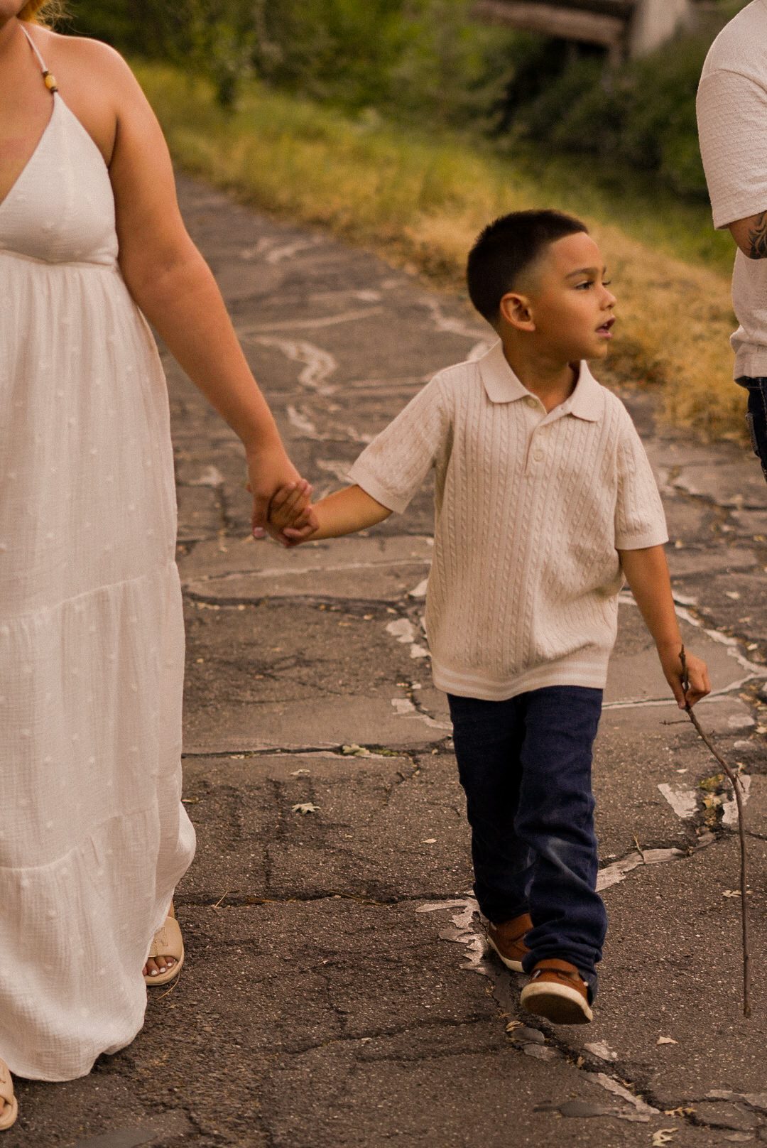 Mom walking hand in hand with her son