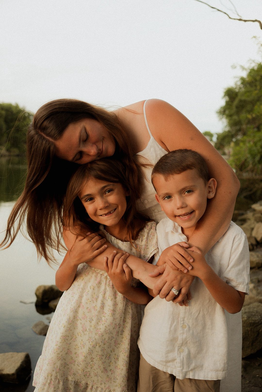 Mom and her two kids by the water