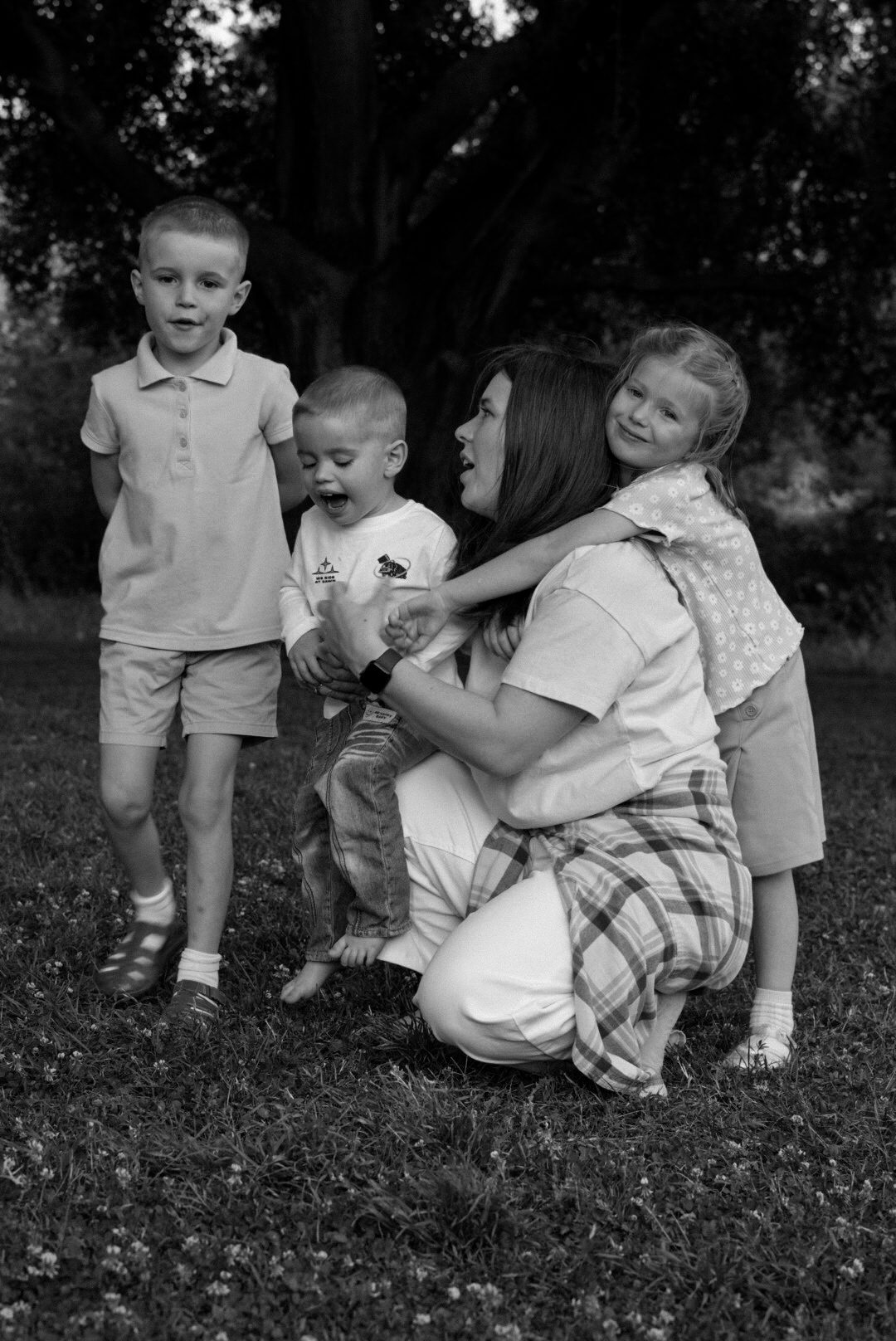 Black-and-white portrait of mom and her kids