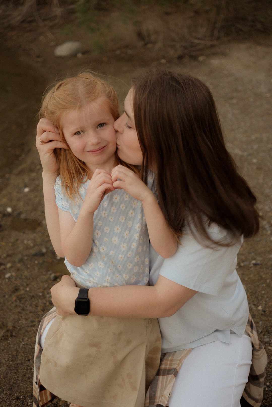 Mom and daughter in matching outfits, embracing