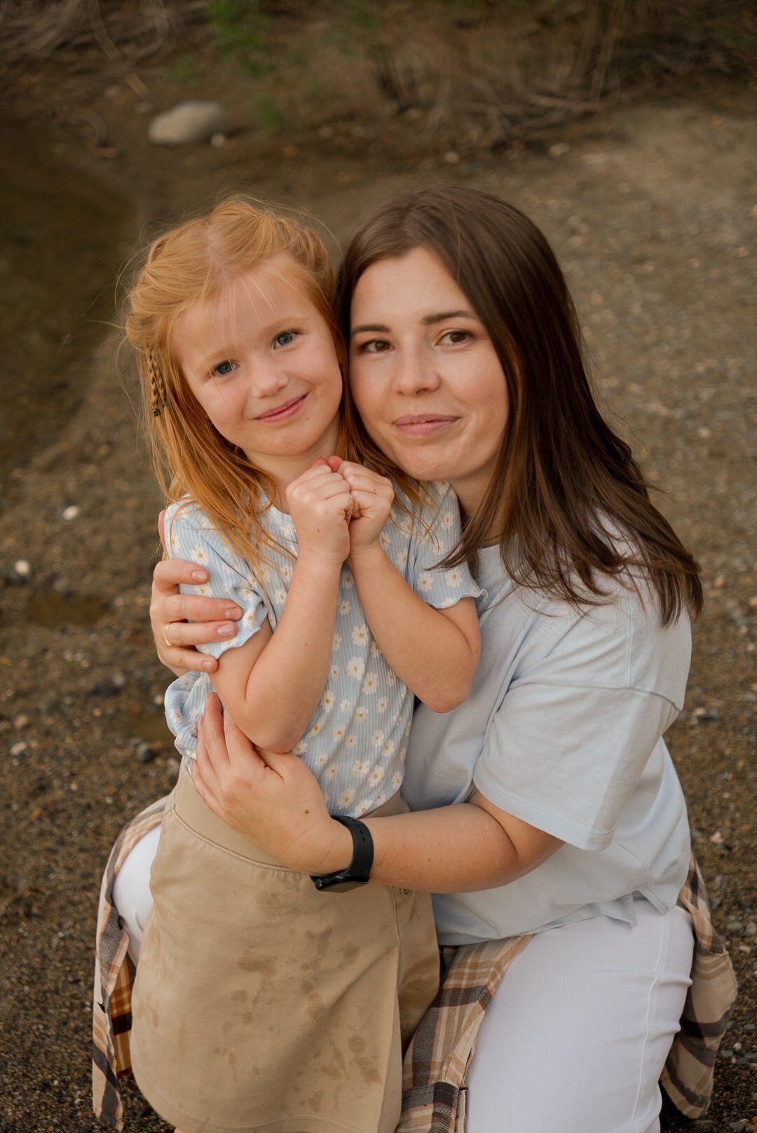 Mom and daughter laughing together