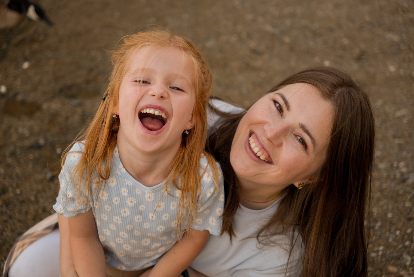 A joyful portrait of mother and daughter