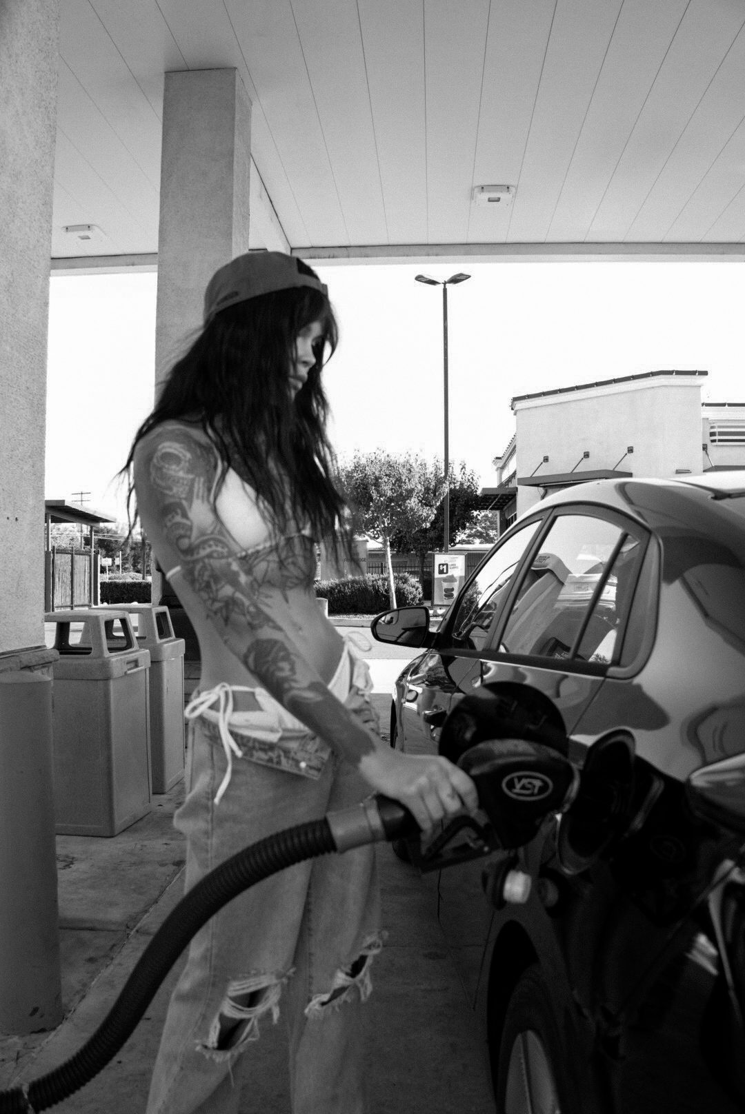 Black-and-white portrait at a gas station