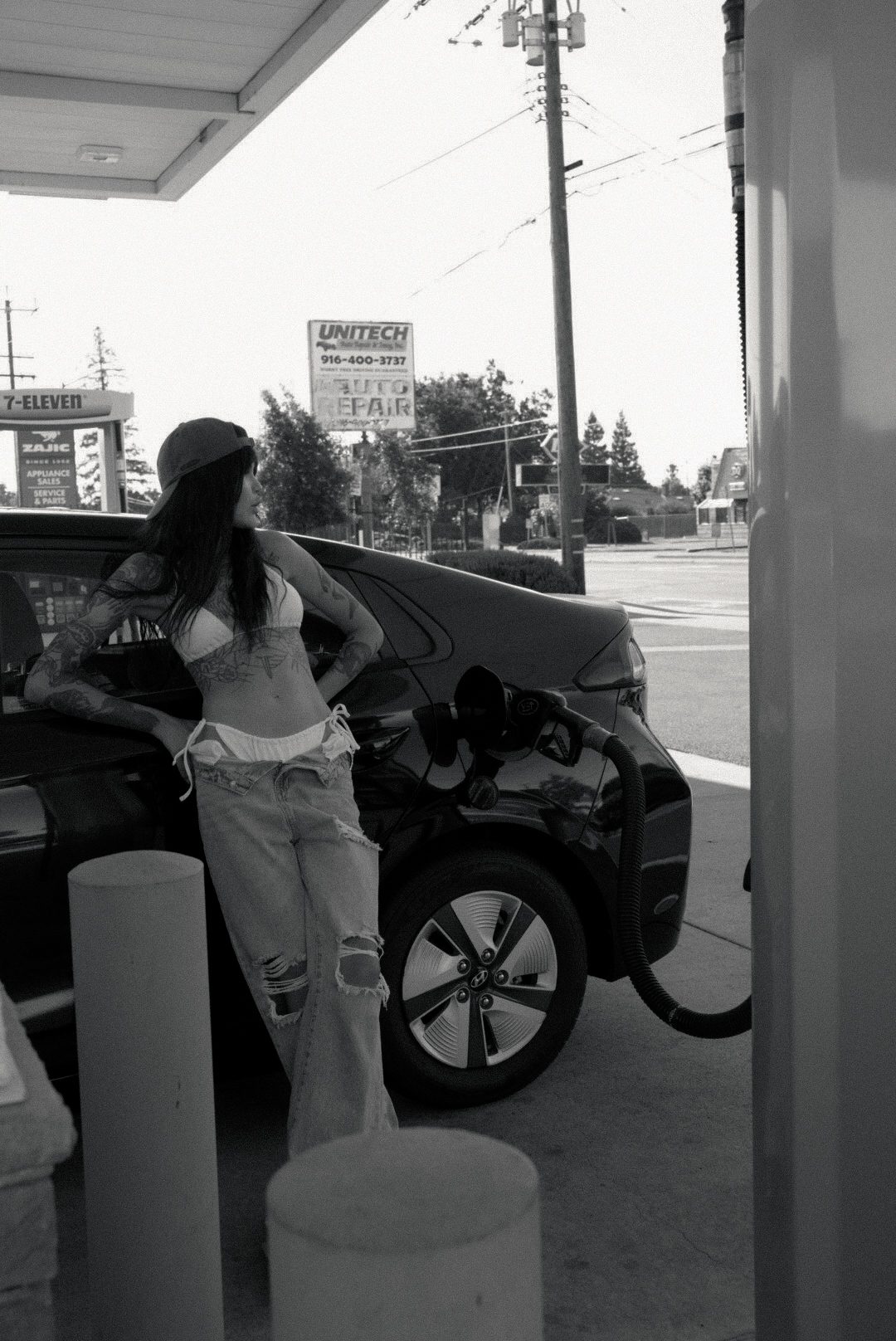 Black-and-white wide shot, urban setting