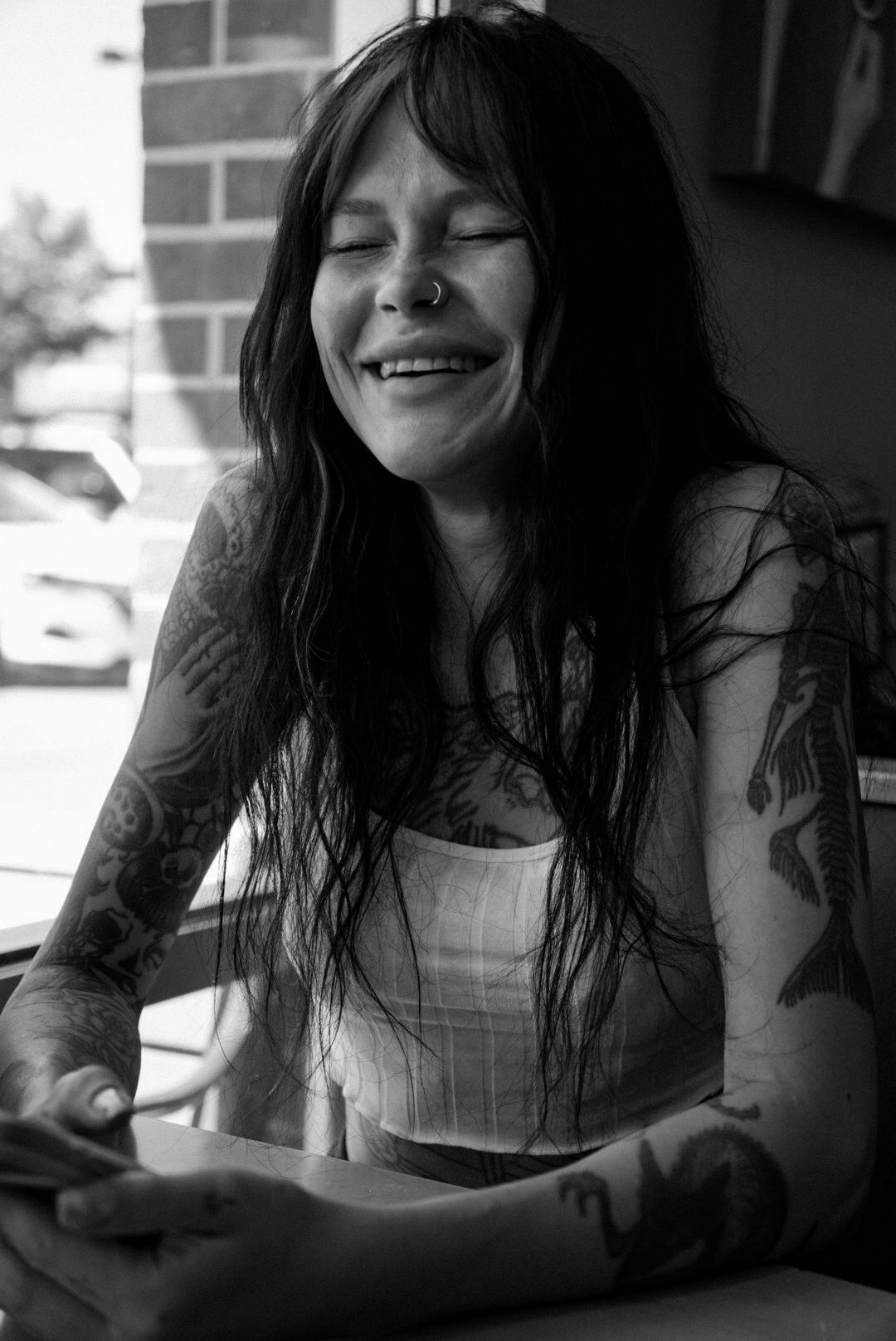 Black-and-white candid portrait, laughing
